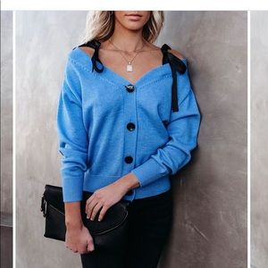 Blue button sweater.  Worn once